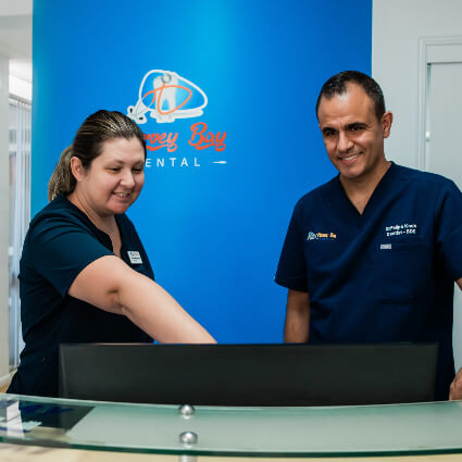 Hervey Bay Dental team behind desk
