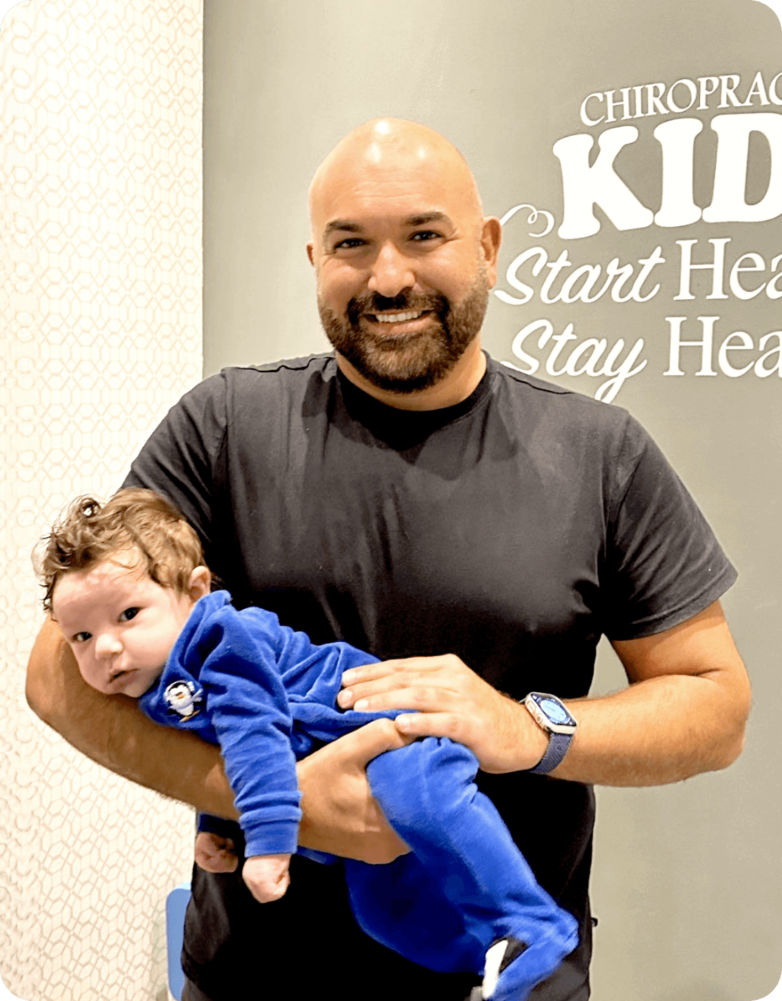 Burlington chiropractor Dr. Maher adjusting a baby