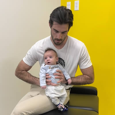 Dr Roy holding little infant