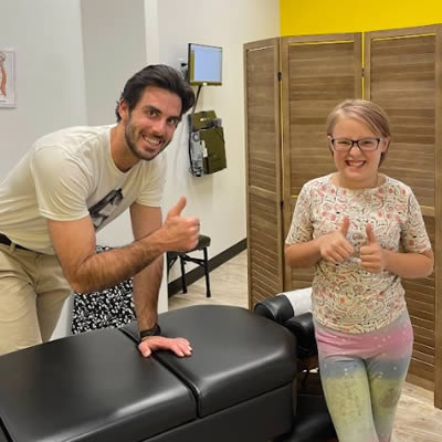 Chiro with kid thumbs up