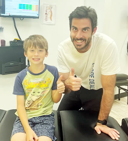 Thumbs up with Dr Zao and kid patient