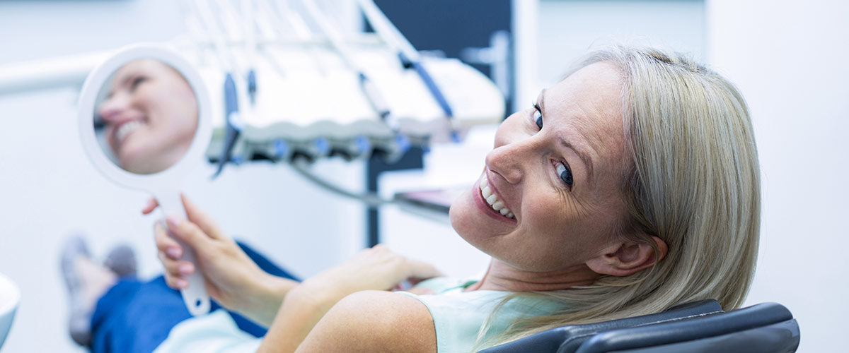 person smiling looking over their shoulder