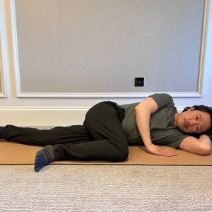laying on ground leg stretch