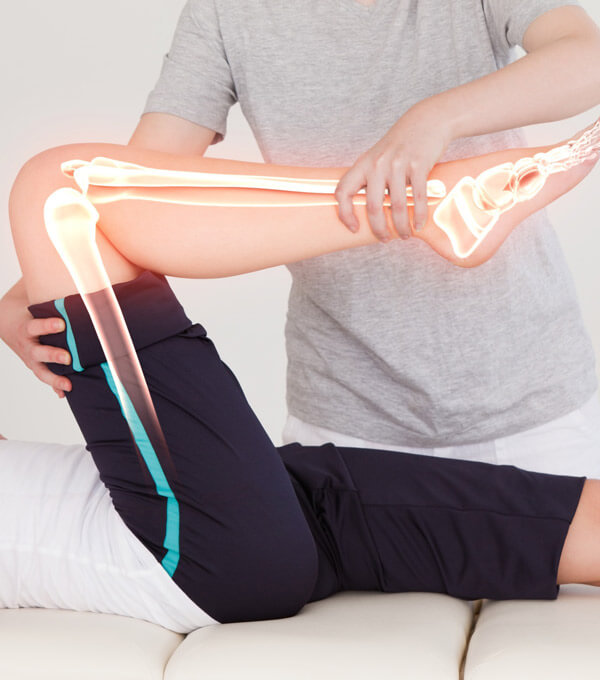 A woman receiving a therapy on leg