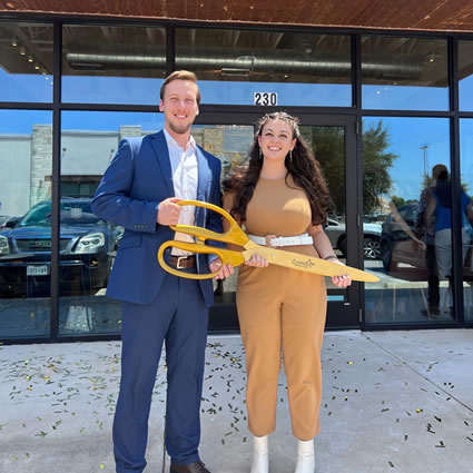 Doctors holding huge shears