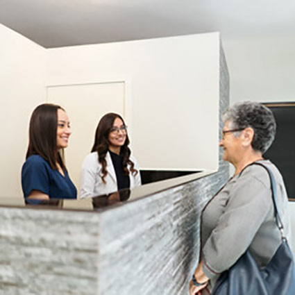 smiling people at front desk