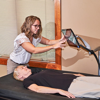 person laying on hydromassage table