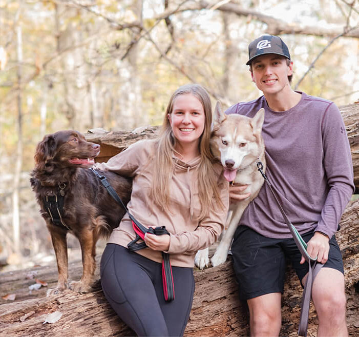 Dr. Emilie with husband and dogs