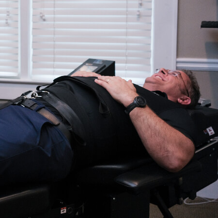 Close up view of man receiving Spinal Decompression treatment