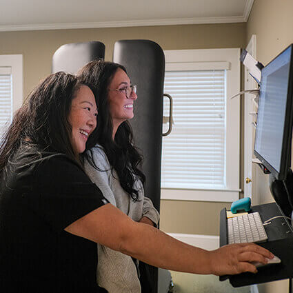 our team looking at a computer