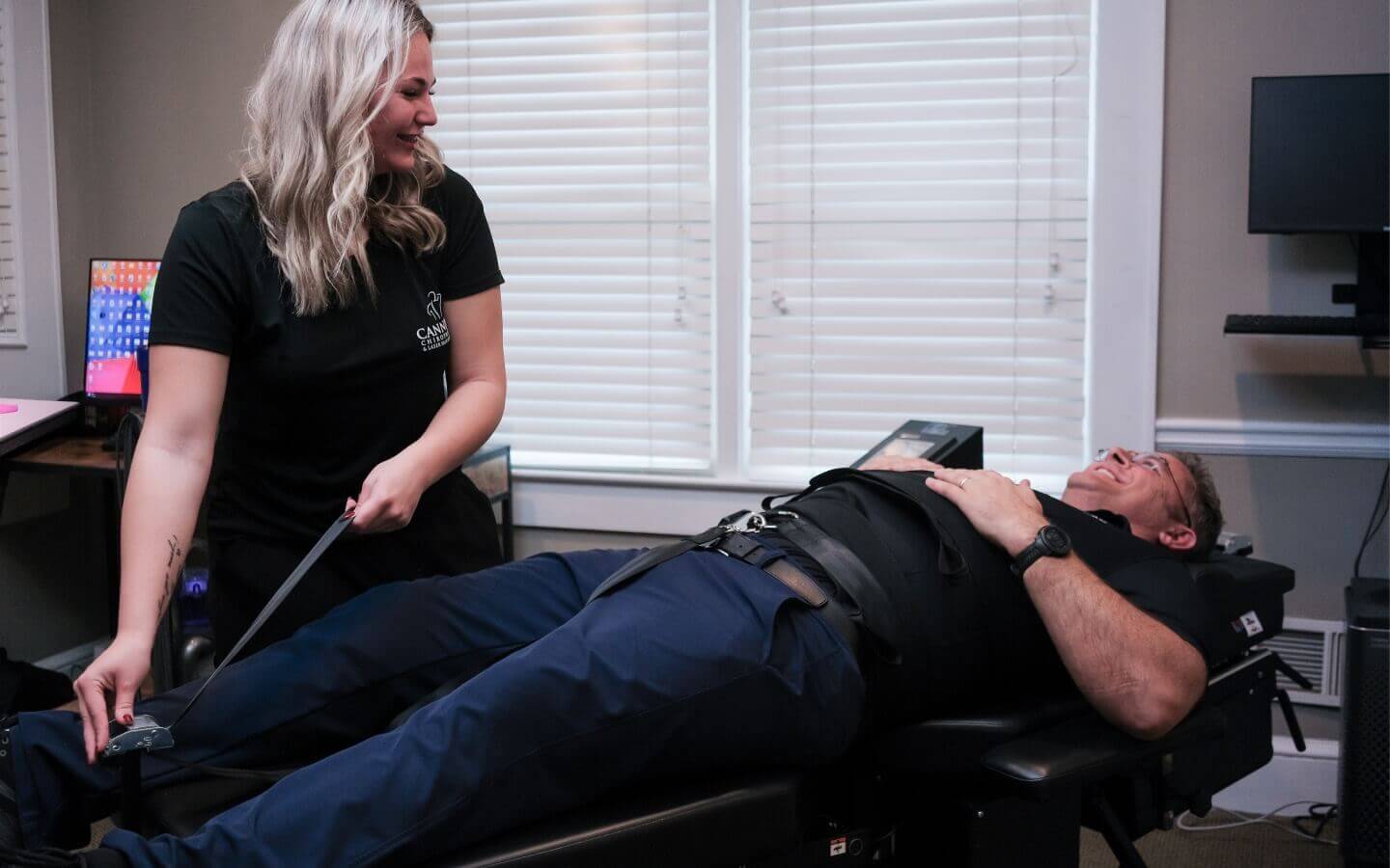 Lawrenceville chiropractor Dr Chris adjusting patients neck