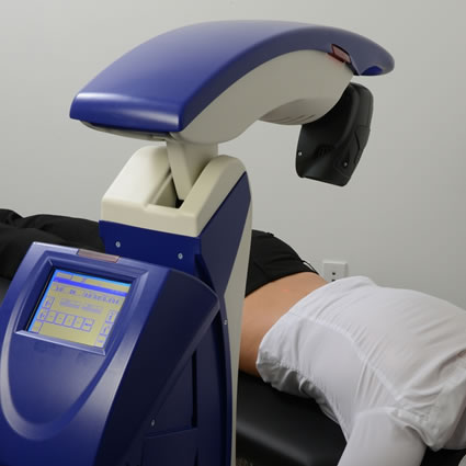 A woman receiving laser treatment on her back