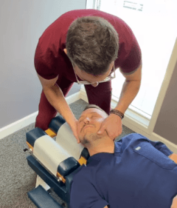 Dr. Vezendy adjusting neck