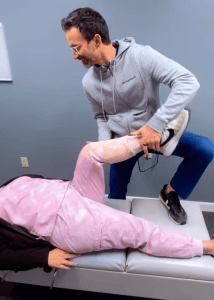 Patient receiving non-surgical knee therapy at Cannon Chiropractic in Kannapolis, NC near Dale Earnhardt Blvd.