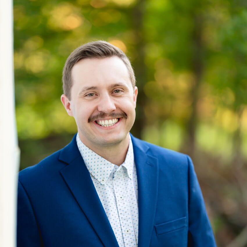 Dr. Dustin Minnick, chiropractor at Cannon Chiropractic in Kannapolis, NC, standing outdoors