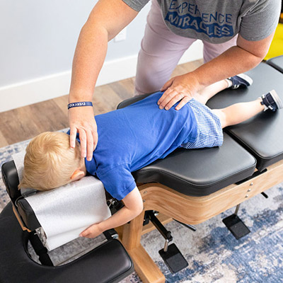 young boy chiropractic adjustment