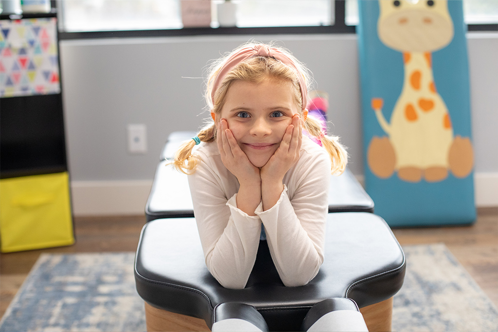 Girl smiling on clinic bed