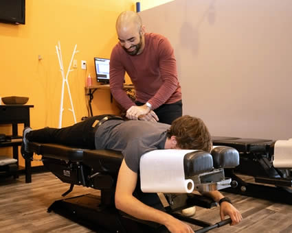 Adjusting man on table