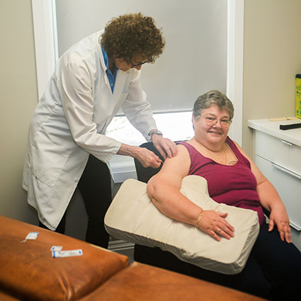 Acupuncture on patients shoulder