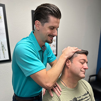 Doctor adjusting patients neck