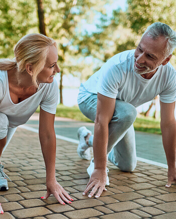Couple stretching before run