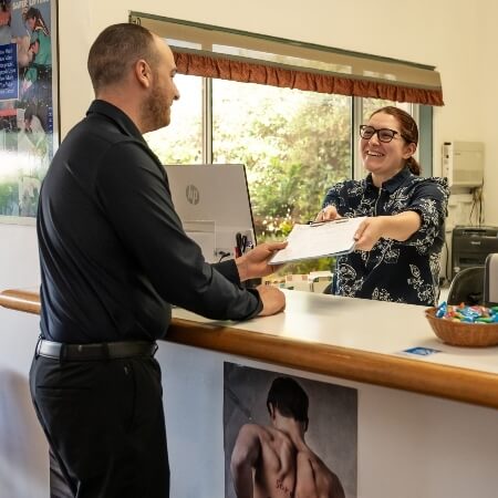 Patient checking in at reception