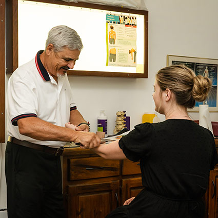 Dr Fico using the graston technique