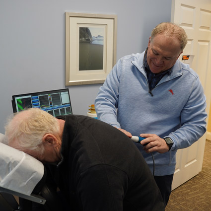 Dr. Brad Double using chiropractic pro-adjuster tool