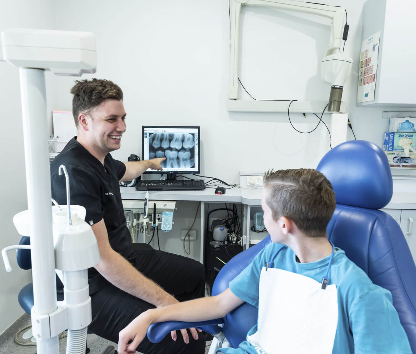 child looking at dentist