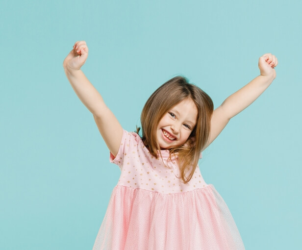 girl with arms up celebrating