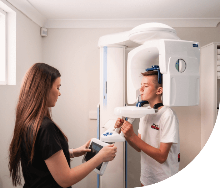 child looking at dentist