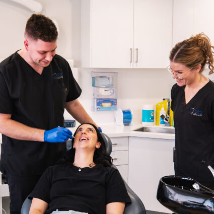 Dentist looking in patient's mouth