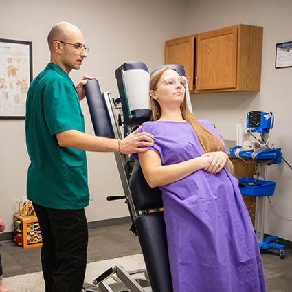 person laying on chiro table