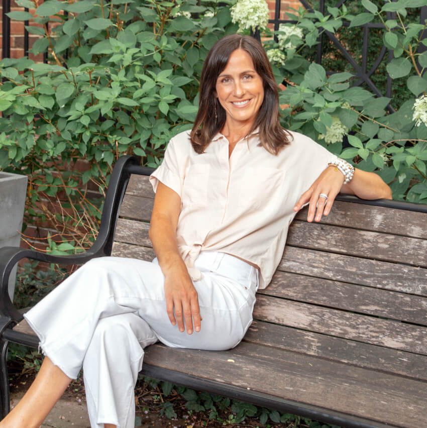 Franklin chiropractor Dr Stacey sitting on a bench