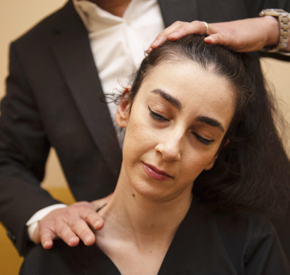 adjusting woman's neck