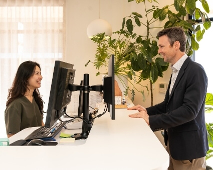 Patient checking in at reception