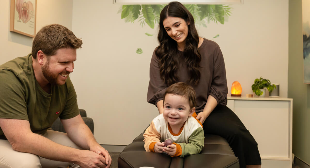 Paediatric patient receiving an adjustment at Oasis Chiropractic