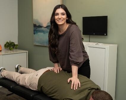 Chiropractor adjusting male patient