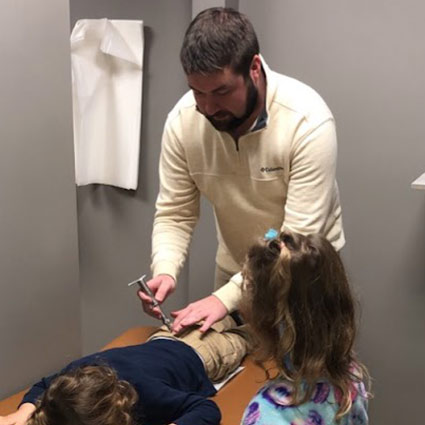 Dr Christian adjusting child