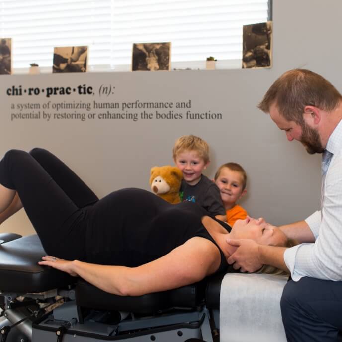 Pregnant woman being adjusted