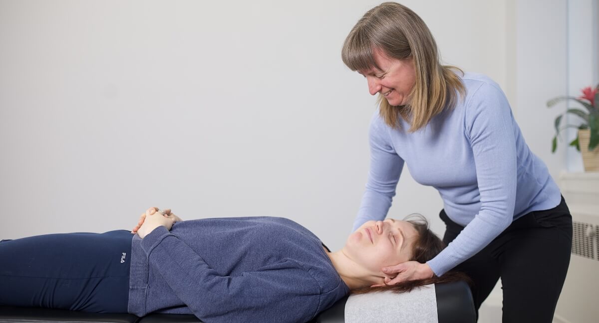 North York chiropractor Dr. Stacey adjusting female patient's neck