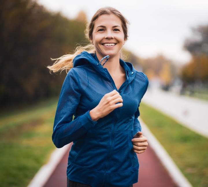 Woman smiling while on a jog