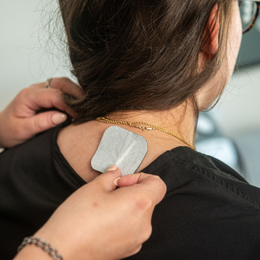 e-stim pad on patients neck