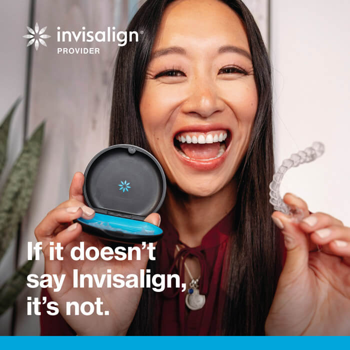 woman holding invisalign aligners and case