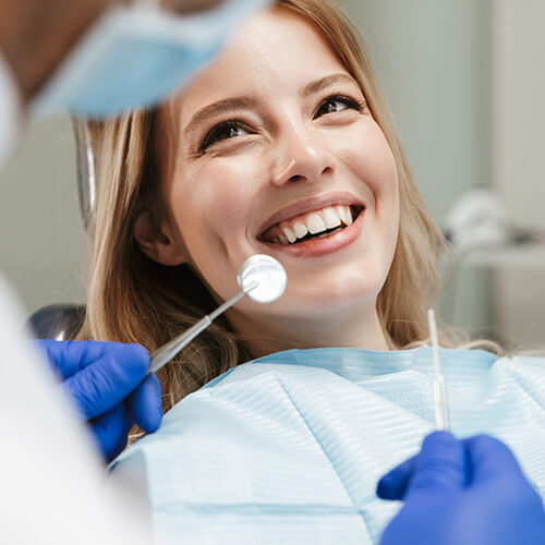 Smiling patient in dental chair