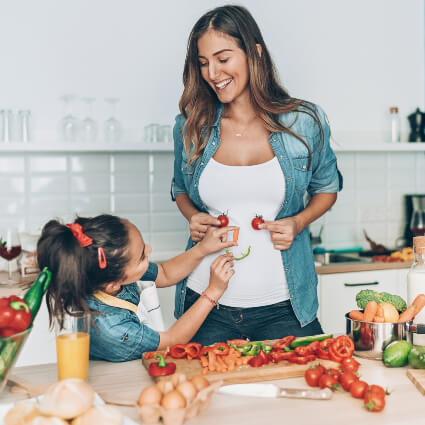 Mom and daughter preparing a healthy meal