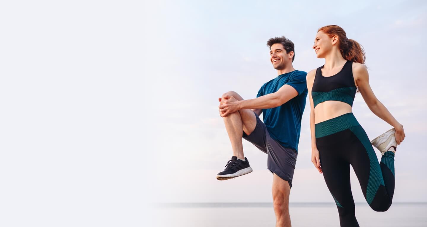 two happy people working out