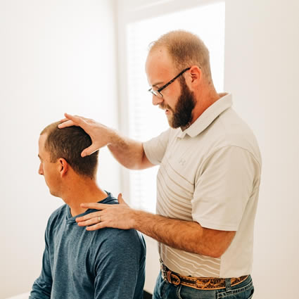 Adjusting man's neck