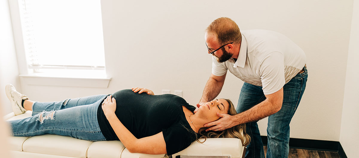 Adjusting pregnant woman's neck