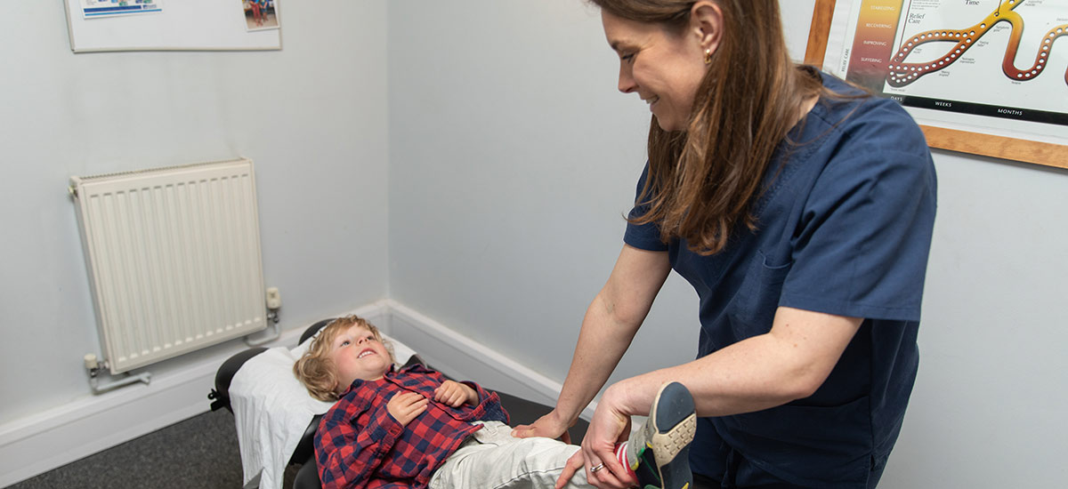 chiropractor adjusting child